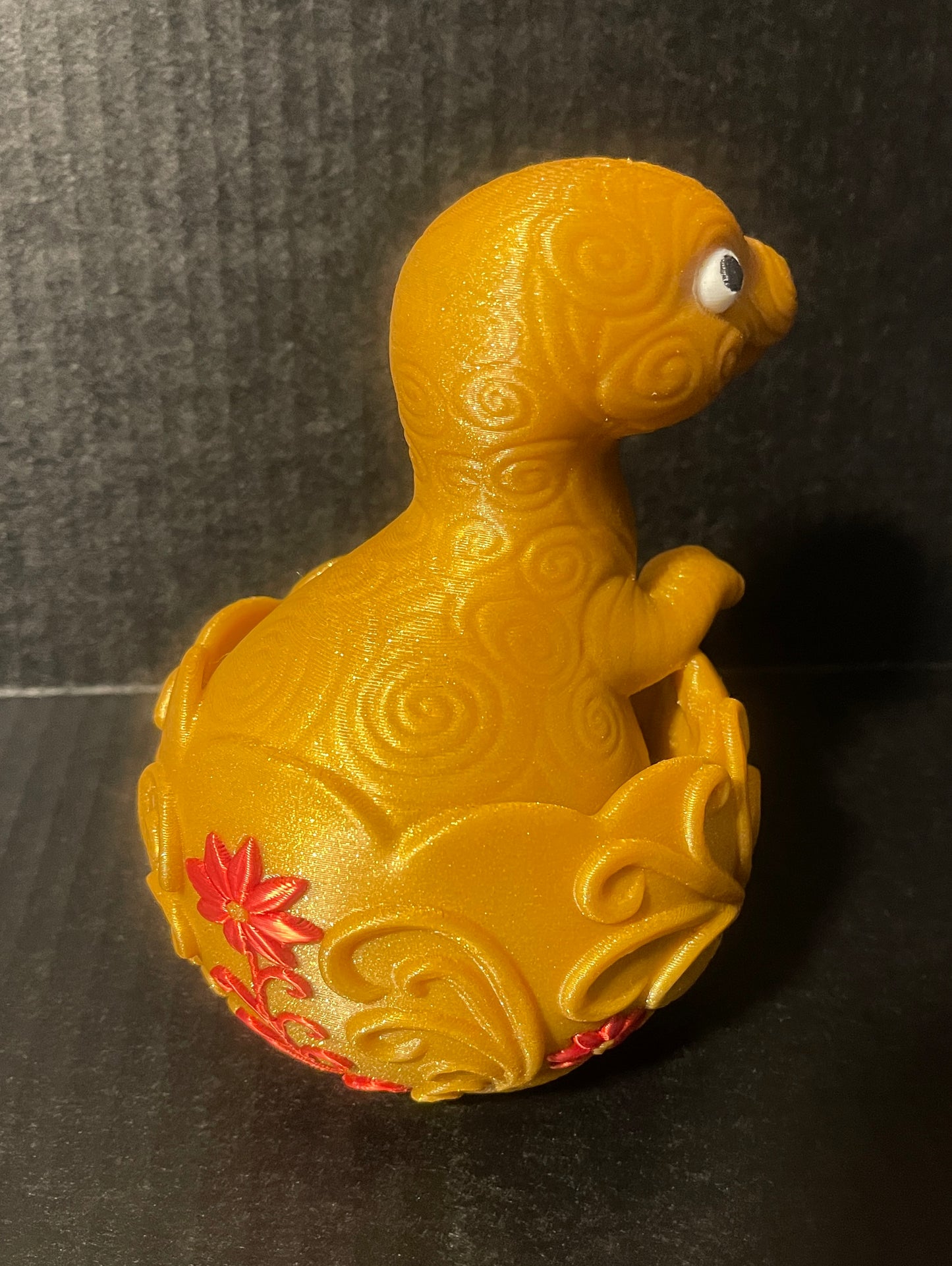 Baby dinosaur hatching from an egg